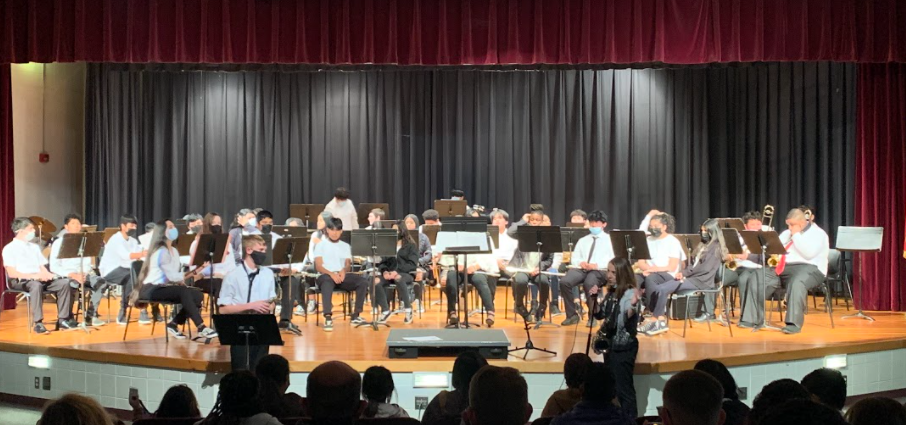 The NAMS Band is on the stage in theater ready to perform for the Winter Contert.