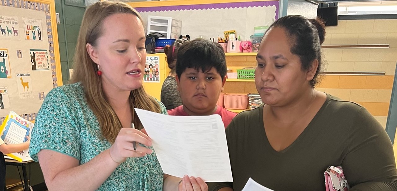 Teacher and family at open house