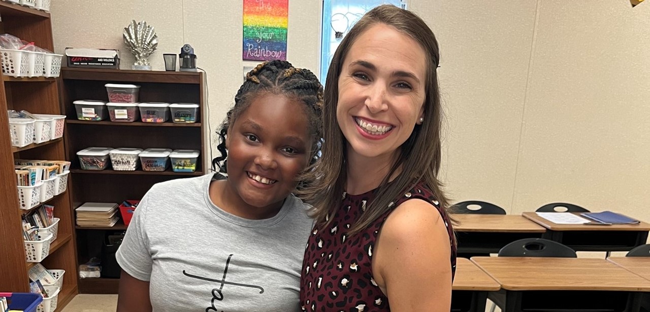 Teacher and student at open house
