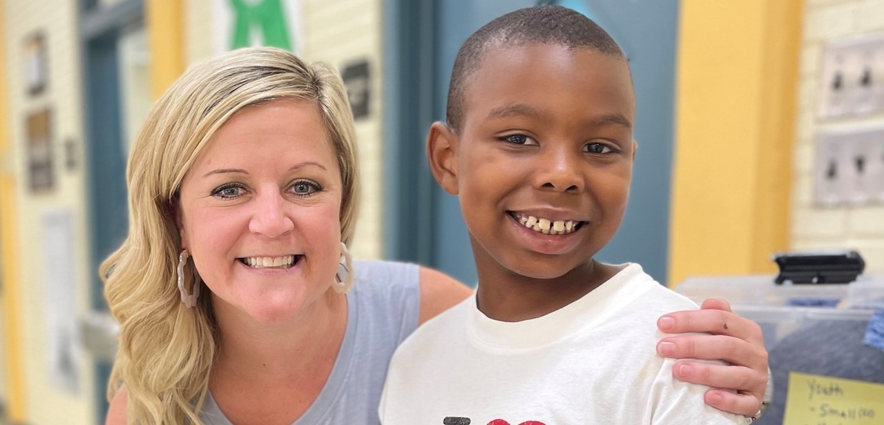 Teacher and student at open house